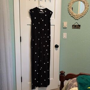 Loft black with white polka dot jumpsuit. Snaps up the front. Ruffle cap sleeve.